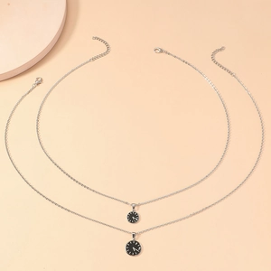 Minimalist clock-themed couple necklaces with black circular pendants and silver chains