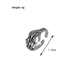 Gothic punk skull hand ring with vintage oxidized finish and 4g weight detail