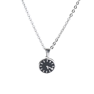 Detail of minimalist round clock pendant necklace with silver chain and black watch face