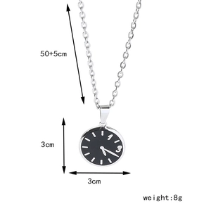 Macro shot of clock dial pendant with white markers and necklace size dimensions