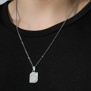 Chinese mahjong Facai pendant in silver titanium steel worn on a black sweater