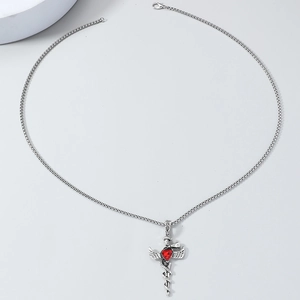 Collier croix gothique argenté avec ailes d'ange, serpent et pierre coeur rouge