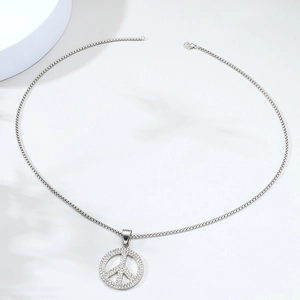 Hip hop silver peace sign pendant necklace with sparkling diamonds on white background