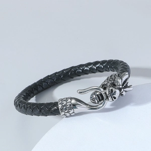 Bracciale da uomo in pelle nera intrecciata con chiusura in metallo argentato a doppia testa di drago