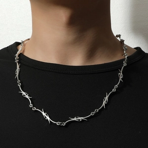 Men's hip-hop punk style silver thorn necklace on black shirt with minimalist design