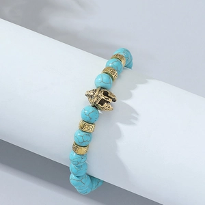 Blue weathered agate bead bracelet featuring a golden Spartan helmet and textured metal charms