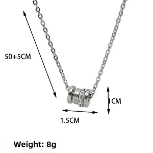 Macro detail of cylinder pendant necklace showing 1.5x1cm dimensions and 8g weight