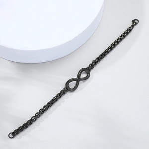 Macro shot of matte black box chain bracelet with infinity symbol and lobster clasp