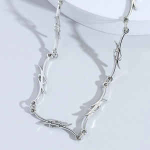 Minimalist silver hip-hop thorn necklace featuring punk style tribal spike chain links