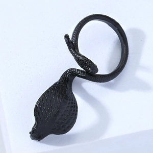 Close-up of matte black cobra ring showing detailed snake scale texture and punk style