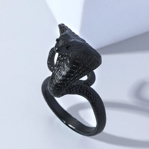 Macro shot of a black cobra snake ring with detailed scale texture in punk gothic style