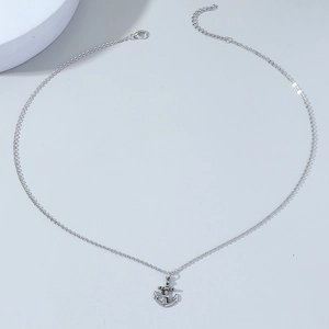 Silver punk anchor pendant necklace for men with vintage finish on light grey background