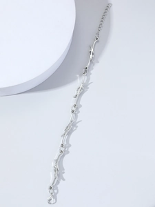 Detail of silver thorn chain necklace with lobster clasp in gothic punk style