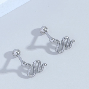 Minimalist silver snake stud earrings with spiral ball back closure on neutral background