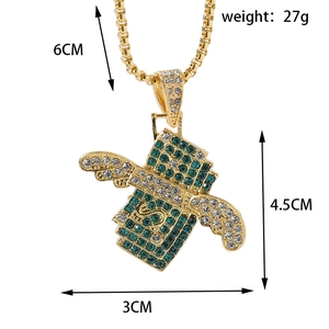 Detailed view of hip hop dollar bill pendant with green rhinestones, 4.5cm by 3cm size