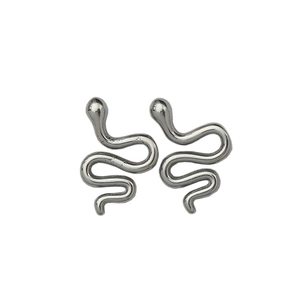 Minimalist silver snake stud earrings in polished metal with smooth S-shaped curves