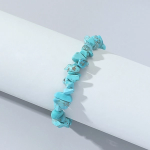 Bohemian style turquoise and tiger eye stone beaded bracelet on white display stand