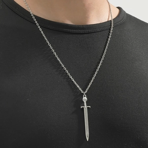 Luminous cross sword pendant necklace in silver stainless steel on a black t-shirt