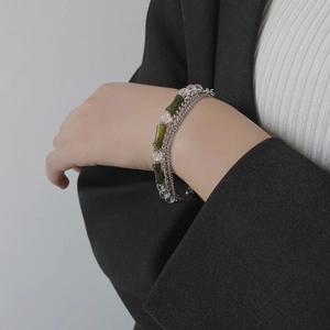 New Chinese style green bamboo bead bracelets set shown on a model wrist in a minimalist style