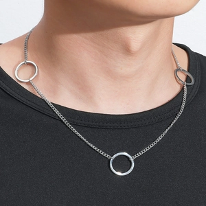 Minimalist silver titanium curb chain necklace with three polished rings on black tee