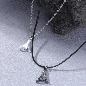 Couples Shaka gesture pendant necklaces in silver and gun-black finish with metal chain