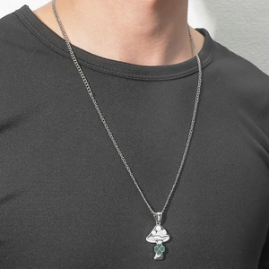 Minimalist alloy mushroom pendant necklace with clover detail on black shirt