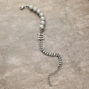 Gothic style bracelet featuring silver Cuban links, grey pearls and a B letter pendant