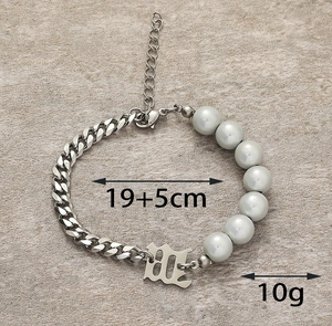 Detail of Cuban link and grey pearl bracelet with Gothic M letter, 19+5cm length