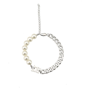 Detail of pearl and silver Cuban chain bracelet featuring a number 18 metal pendant