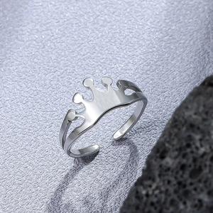 Minimalist adjustable crown ring in silver stainless steel on textured background