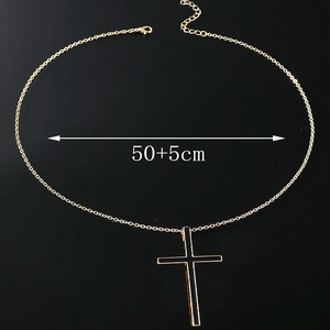 Detail of cross pendant necklace with black enamel inlay and 50+5cm adjustable gold chain
