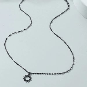 Minimalist black sun pendant necklace with hollow sunburst charm for women