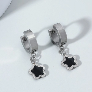 Minimalist silver flower hoop earrings with black enamel center and metal accents