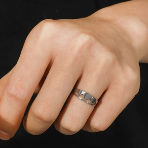 Minimalist adjustable stainless steel heart ring for men shown on finger