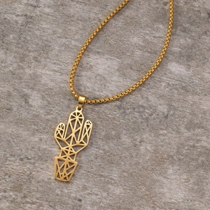 Detailed close-up of golden geometric cactus pendant on a fine box chain necklace