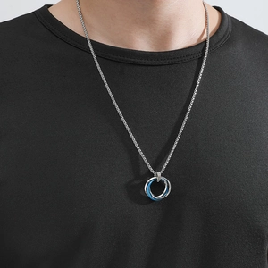 Men's necklace featuring minimalist silver and blue interlocking triple ring pendants