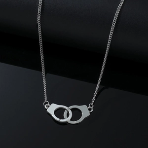 Polished stainless steel double handcuff pendant necklace on a sleek black reflective base