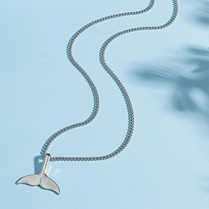 Elegant silver mermaid tail necklace with a minimalist dolphin tail pendant for women