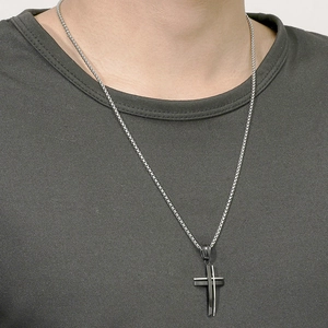 Minimalist black and silver layered stainless steel cross necklace for men on model
