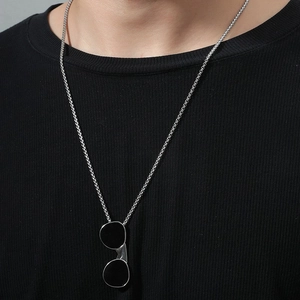 Unisex silver stainless steel necklace with unique sunglasses pendant on black top