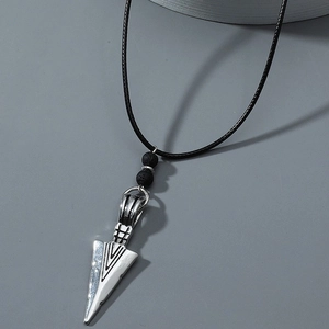 Arrowhead pendant necklace with black lava beads and wax cord on a gray background