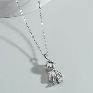 Polished silver astronaut pendant necklace with a minimalist fine link chain for men