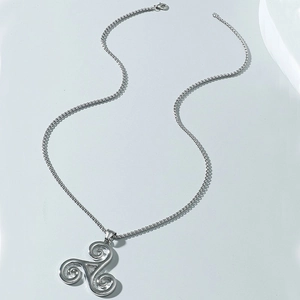 Silver Triskele pendant necklace with a fine square chain in a minimalist Celtic style