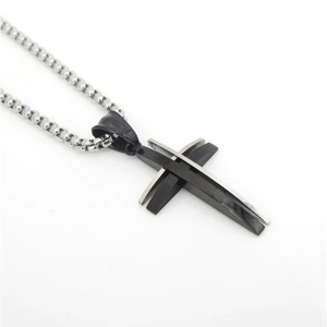 Men's minimalist stainless steel necklace featuring a layered black and silver cross pendant