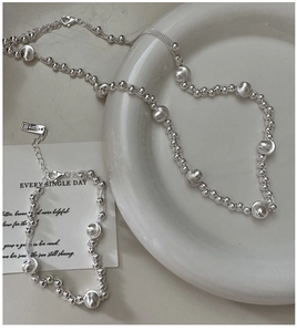 Close-up of S925 sterling silver beaded necklace set with lobster clasp and adjustable chain