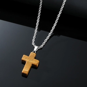 Tiger eye stone cross necklace with silver rope chain on reflective black background