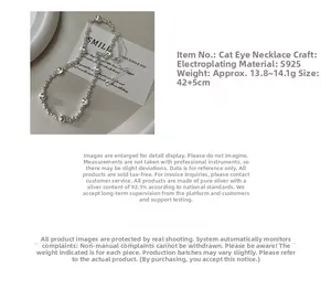 Detailed view of S925 sterling silver beaded necklace with cat eye stones and 42cm chain