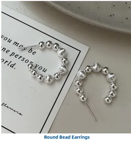 Detail of S925 sterling silver C-shaped earrings with alternating smooth and brushed beads