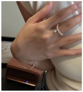 Detail showing polished S925 sterling silver beaded ring with heart pendant and bracelet set