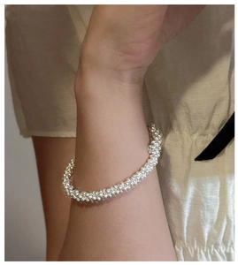 Detail of S925 sterling silver triple beaded bracelet on wrist for daily wear